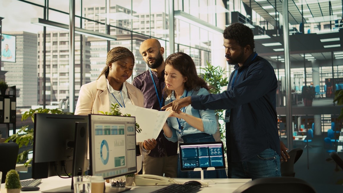 Business team reviewing charts
