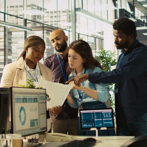 Business team analyzing paperwork
