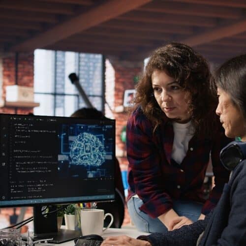 Programmers analyzing AI software