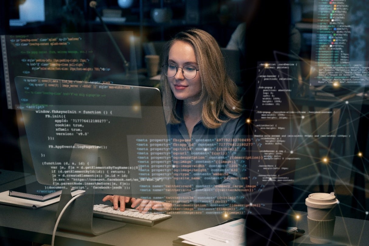 Woman coding at computer